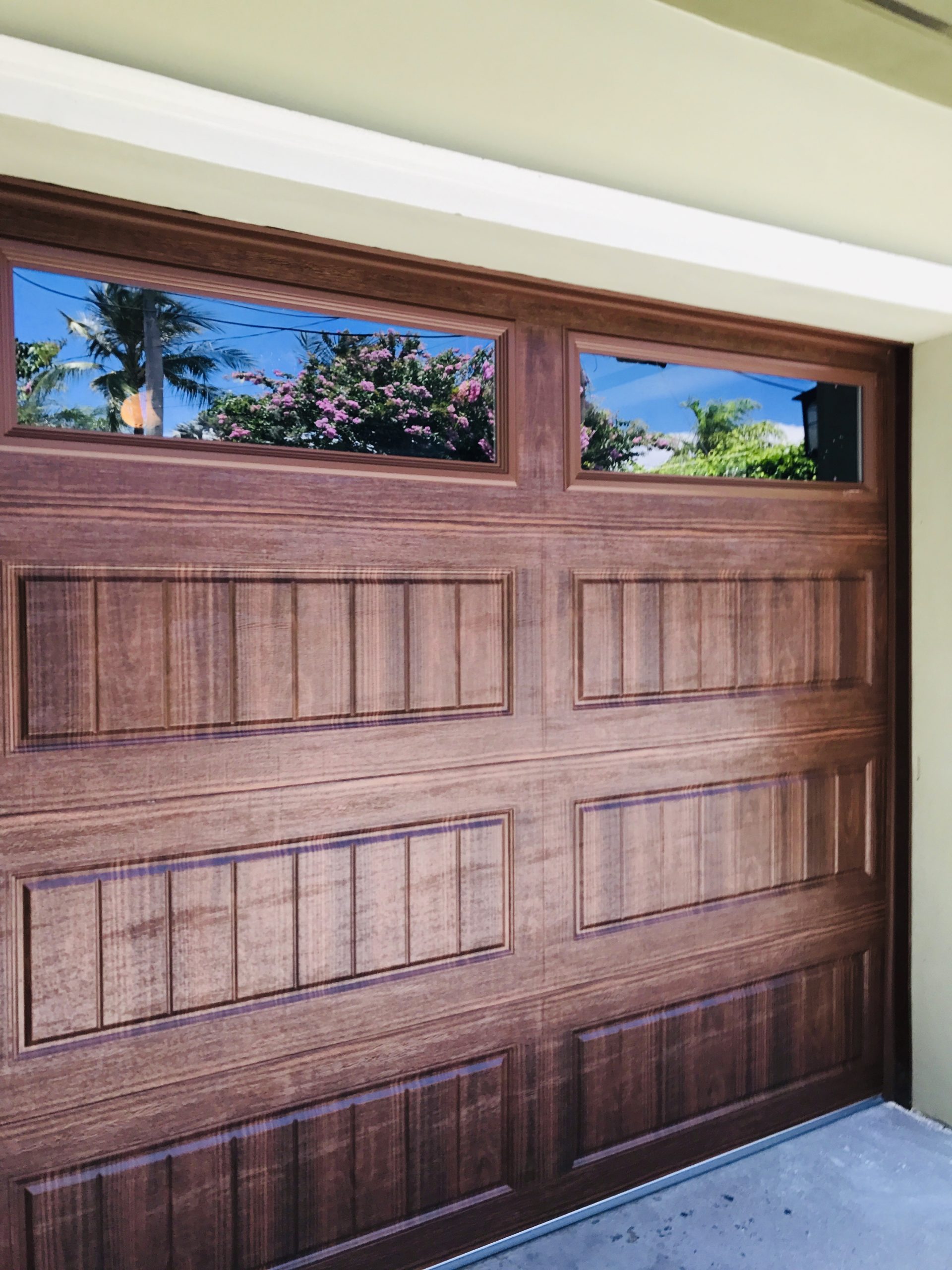 Modern home with hurricane-rated glass garage door installation