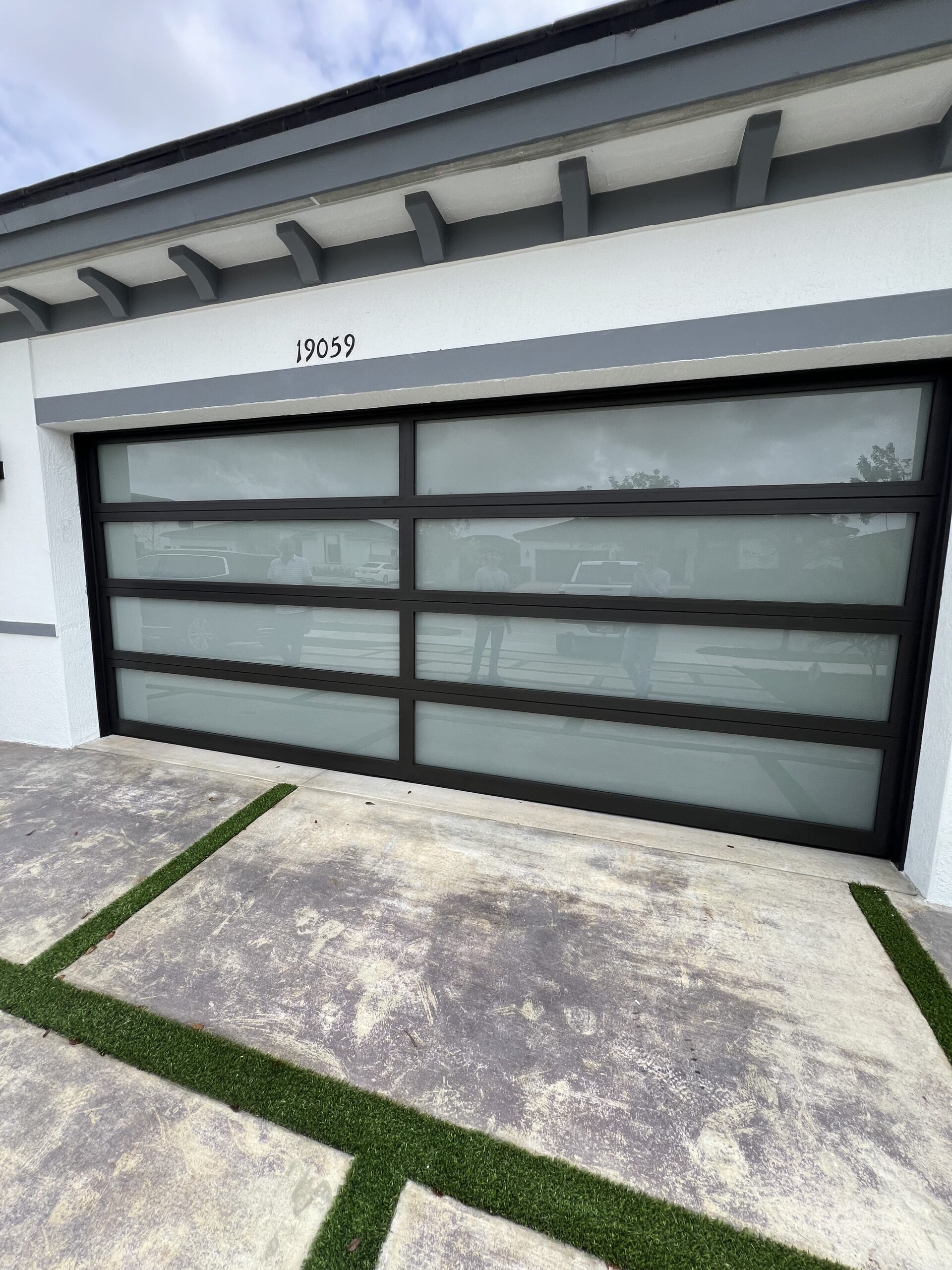 Modern glass garage door installed in Palm Beach County