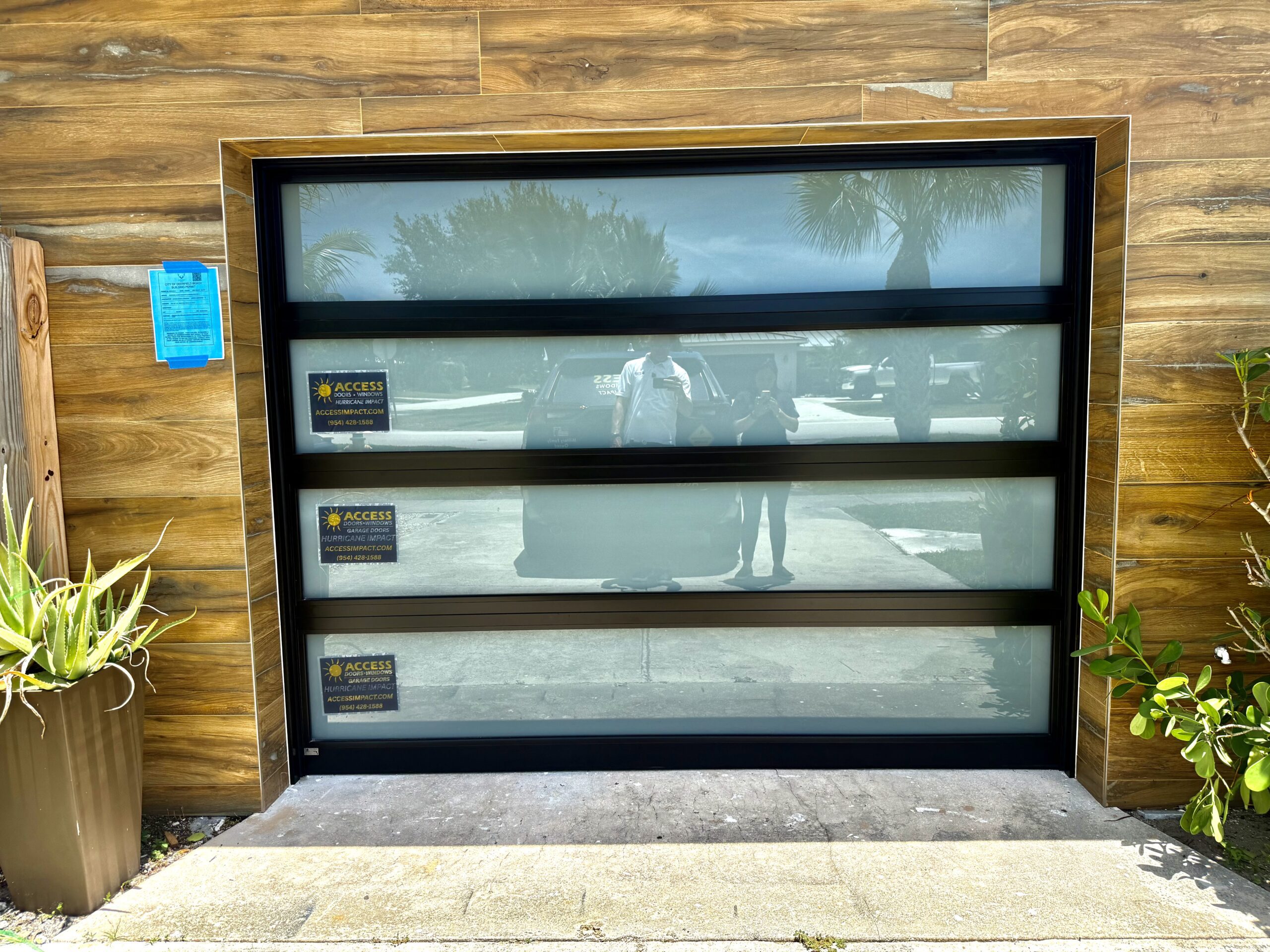 Custom modern glass garage door installation in South Florida