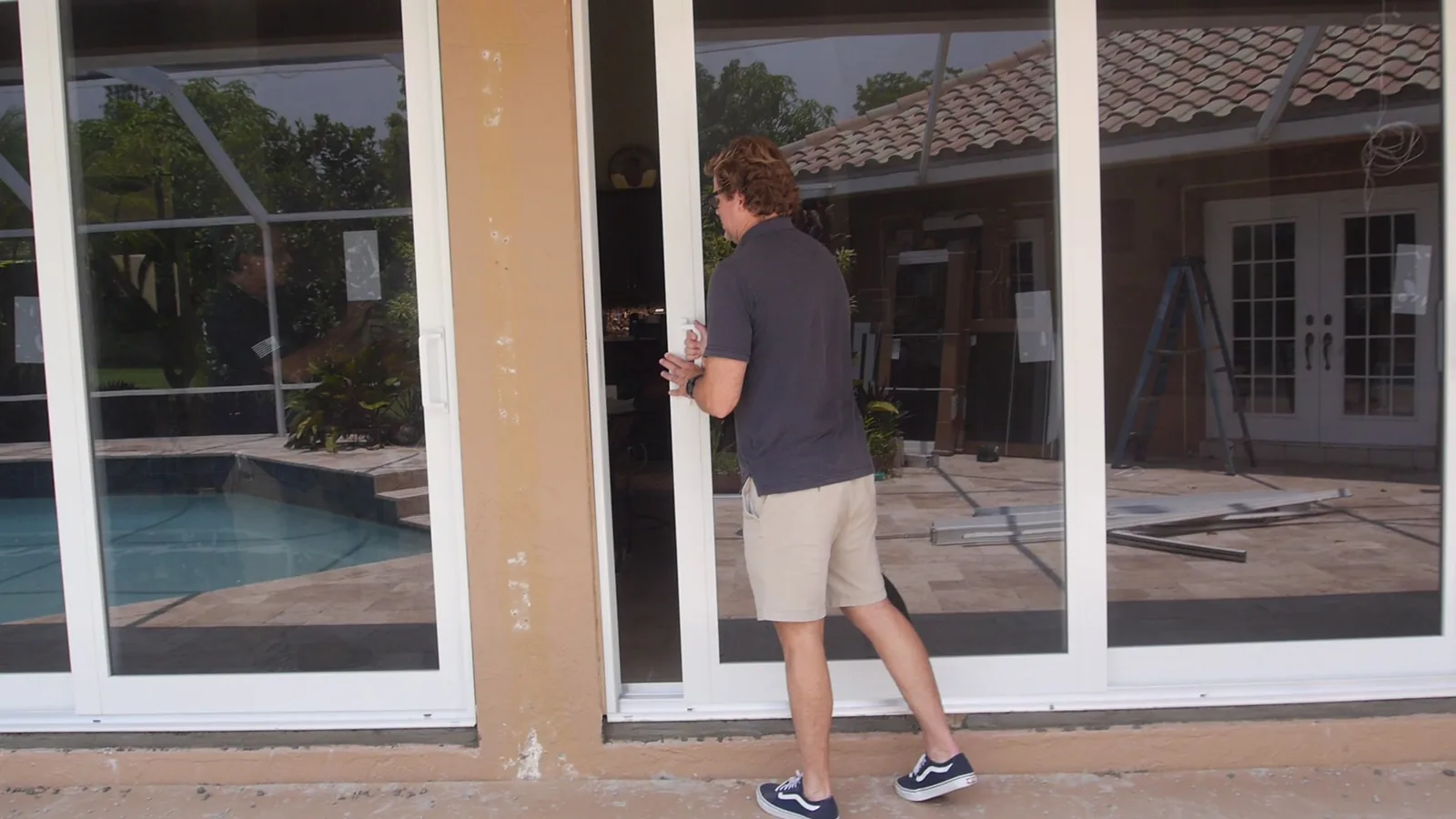 Crew setting a large impact glass panel