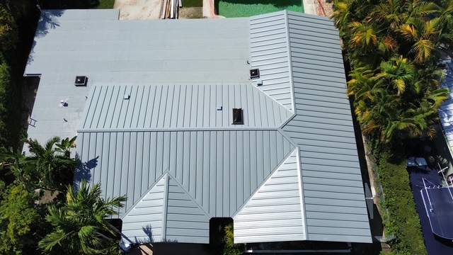 White standing-seam metal roof on a South Florida home