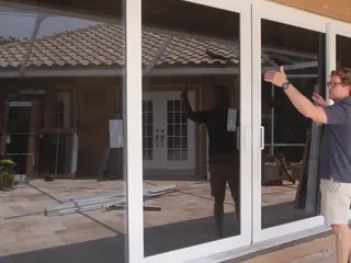 Our installer opening a new sliding glass door on a job